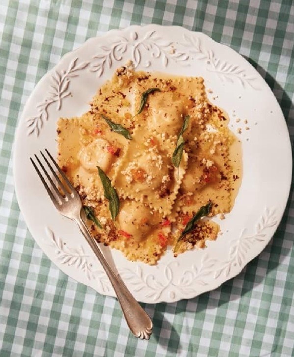 Pumpkin ravioli with amaretti and mustard fruits in burnt butter