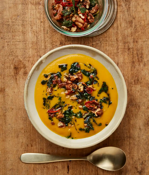 Pumpkin soup, maple walnuts and herb oil