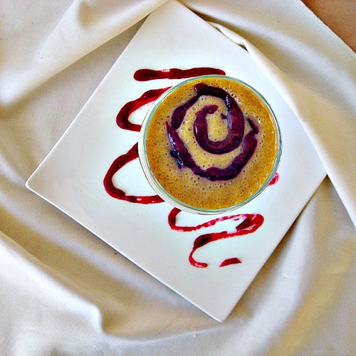 Pumpkin spice milkshake with a cranberry sauce swirl