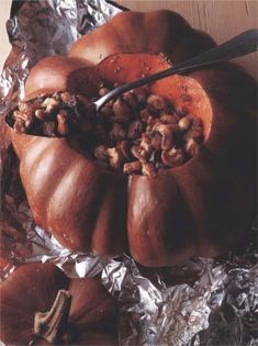 Pumpkin stuffed with spiced turkey and cashew nuts