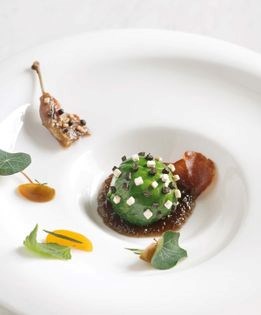 Quail and foie gras praline with black truffle gelée and fines herbes salad