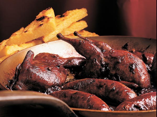 Quail and sausage braised with grapes