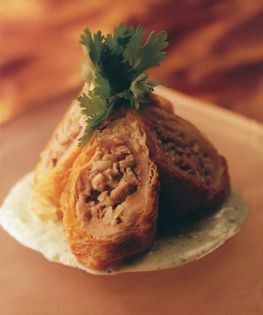 Quail breasts stuffed with shiitake mushrooms and water chestnuts deep-fried in beancurd skins with coriander yoghurt sauce