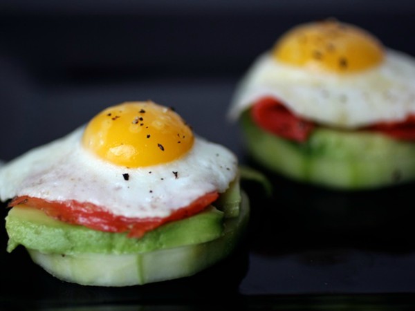 Quail egg canapés with smoked salmon, avocado and pickled cucumbers