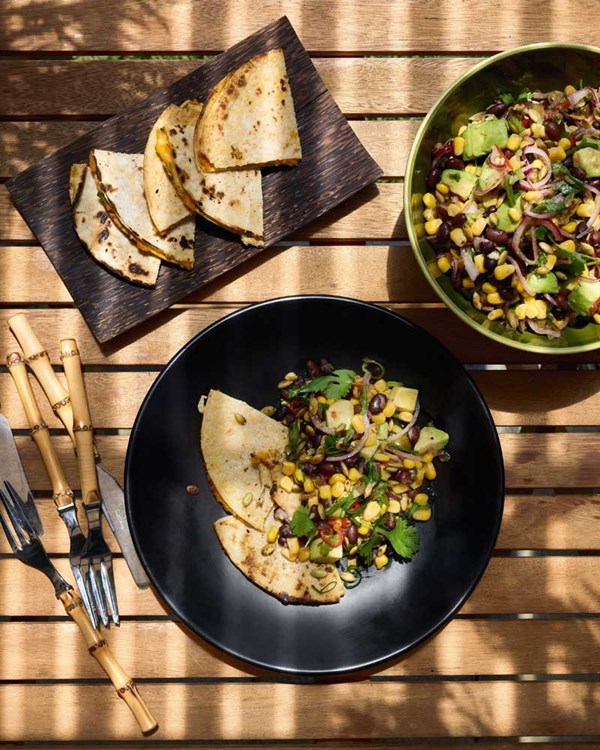 Quesadillas with carrot hummus & charred corn & black bean salad