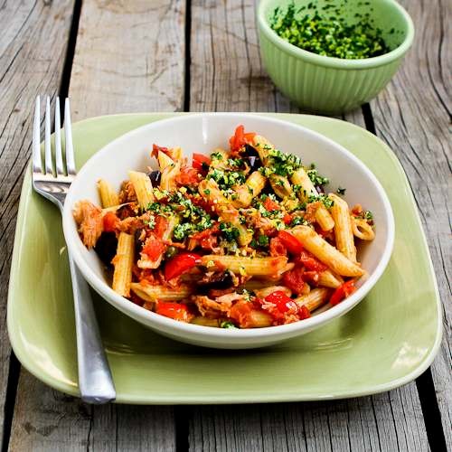 Quick and easy penne pasta with red bell peppers, garlic, capers, olives, tomatoes, and tuna