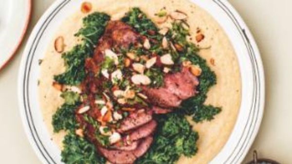 Quick roasted beef fillet with kale on creamy almond polenta