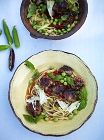 Quick sausage meatballs with a tomato and basil sauce, spaghetti and sweet raw peas