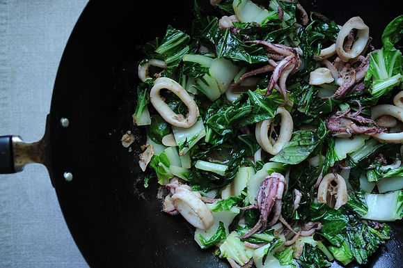 Quick wok-fired squid with greens