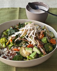 Quinoa and brown rice bowl with vegetables and tahini