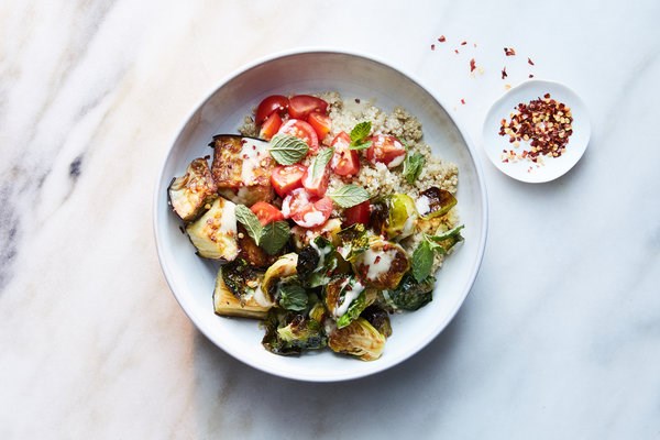 Quinoa bowl with crispy Brussels sprouts, eggplant and tahini