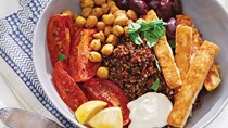 Quinoa bowls with seared halloumi, roasted tomatoes, and chickpeas
