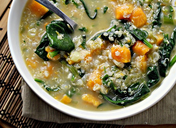 Quinoa chowder with sweet potatoes, spinach, feta, and scallions