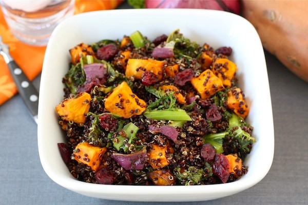 Quinoa salad with roasted sweet potatoes, kale, dried cranberries, & red onion