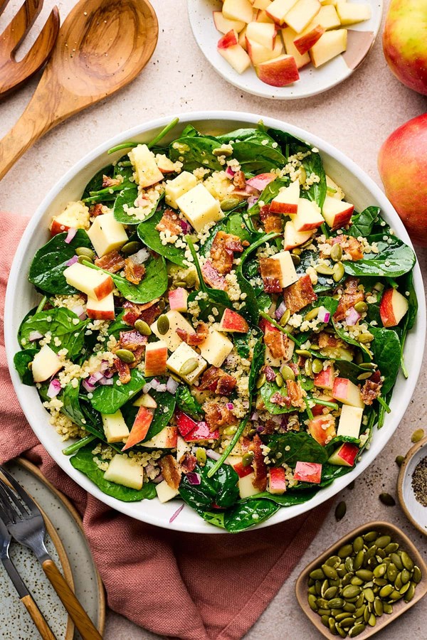 Quinoa spinach salad with apples, bacon & white cheddar