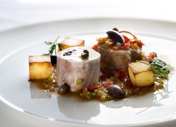 Rabbit, olives, capers, tomatoes and potatoes 