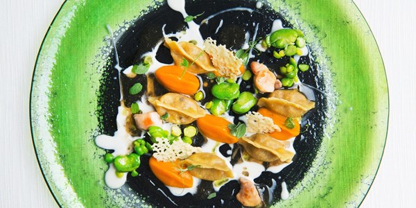 Rabbit ravioli with Ragusano cheese, carrot, broad beans and peas