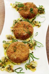Rabbit rissoles (Deep-fried wild rabbit rissoles with cockle and caper dressing and sorrel salad)
