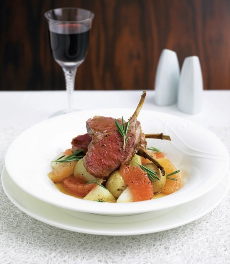 Rack of lamb with new potatoes, pink grapefruit and honey sauce