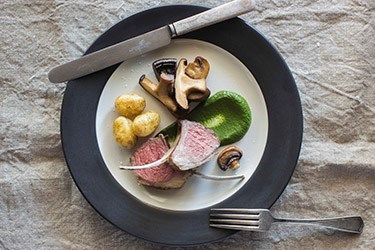 Rack of lamb with spinach puree and mushrooms