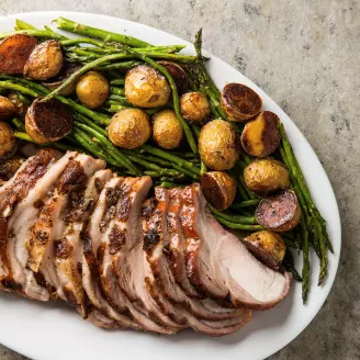 Rack of pork with potatoes and asparagus