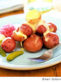 Raclette, or melted cheese, potatoes, and pickles