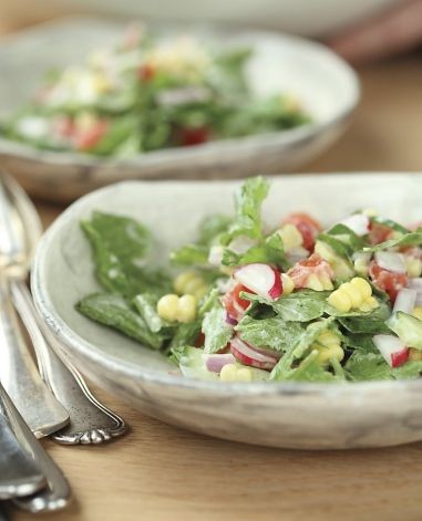 Radish leaf salad with corn, tomatoes & salted cucumbers