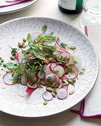 Radish salad with pumpkin seeds and pumpkin oil