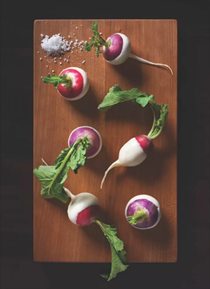 Radishes butter-dipped with fleur de sel