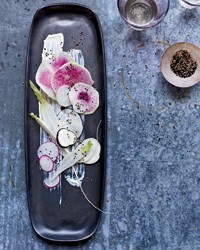 Radishes with sour cream dressing and nigella seeds