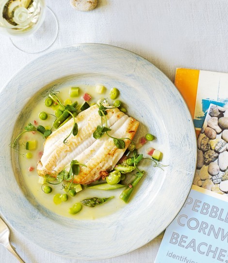 Ragout of sautéed lemon sole with serrano ham, summer vegetables and pea shoots