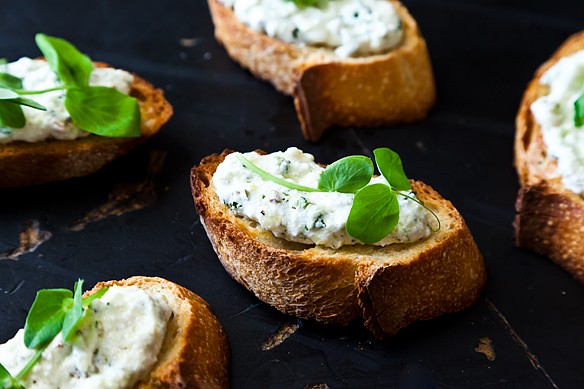 Ramped up crostini with ricotta and pea shoots