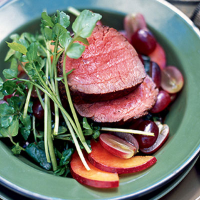 Rare beef with red wine vinaigrette and grape and plum salad