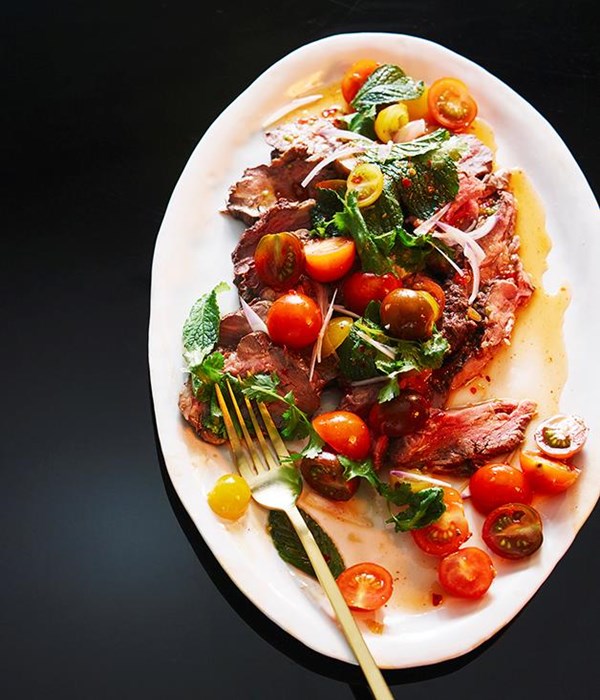 Rare beef with tomato, herb & chilli salad