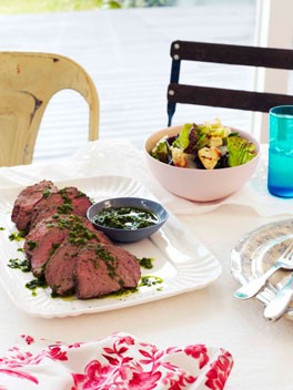 Rare roast beef with anchovies, garlic and rocket salsa verde