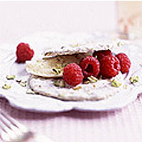 Raspberries with pistachio crisps and clotted cream