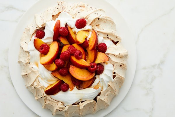 Raspberry Pavlova with peaches and cream
