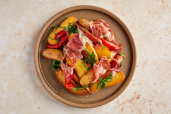 Ratte potatoes with Iberico ham and piquillo peppers