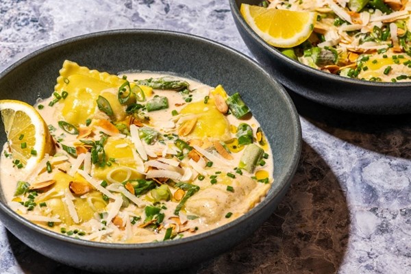 Ravioli and asparagus in toasted almond broth