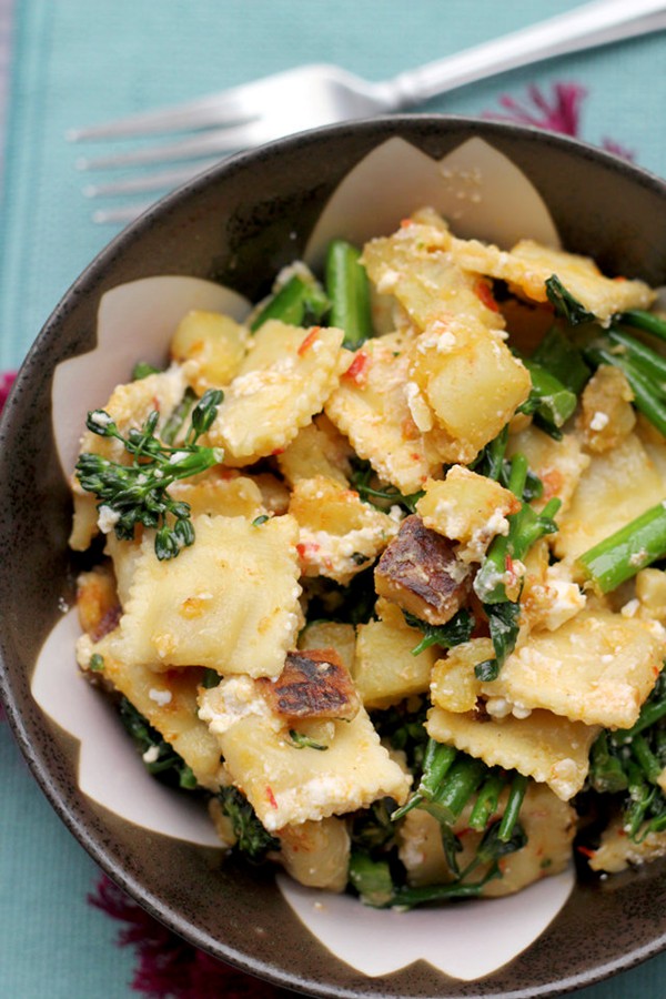 Ravioli salad with broccolini, sweet potatoes, feta, and harissa