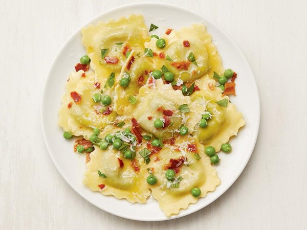 Ravioli with lemon, peas and pancetta