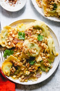 Ravioli with zucchini, corn, and buttery pine nut crunch