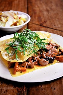 Raviolo with mushrooms and artichoke salad