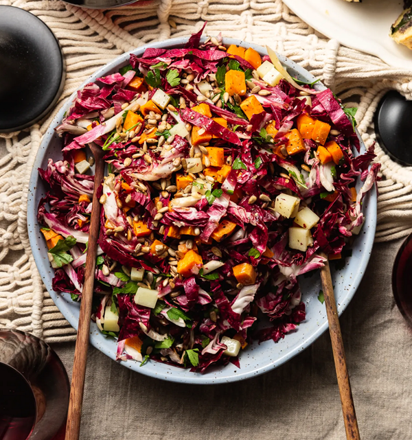 Raw and roasted radicchio salad with sweet potato, Manchego, and crunchy seeds