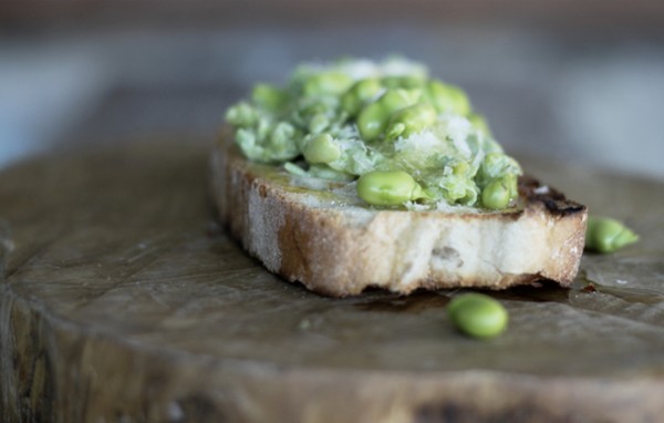 Raw fava bean crostini