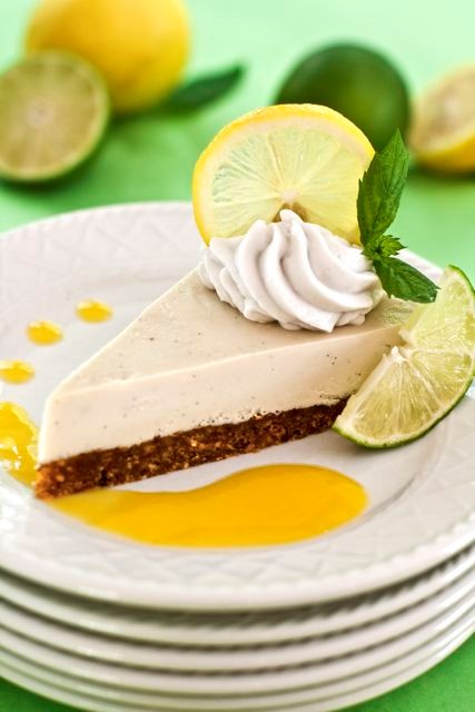 Raw lemon-lime cheesecake with coconut nut crust and fresh mango sauce