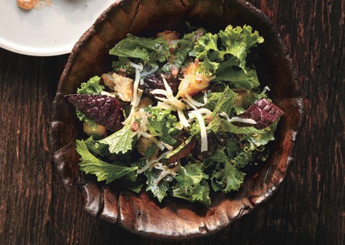Raw mustard greens salad with Gruyère and anchovy croutons