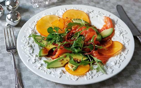 Raw salmon, persimmon and avocado salad with ginger dressing