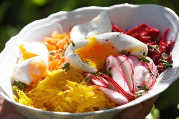 Red and golden beet salad with radishes and soft-boiled eggs