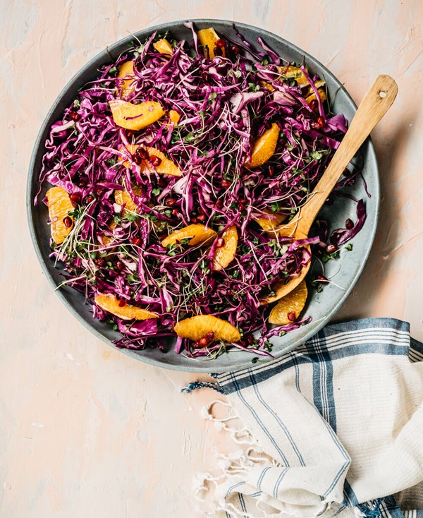 Red cabbage and microgreen salad with citrus and pomegranate seeds